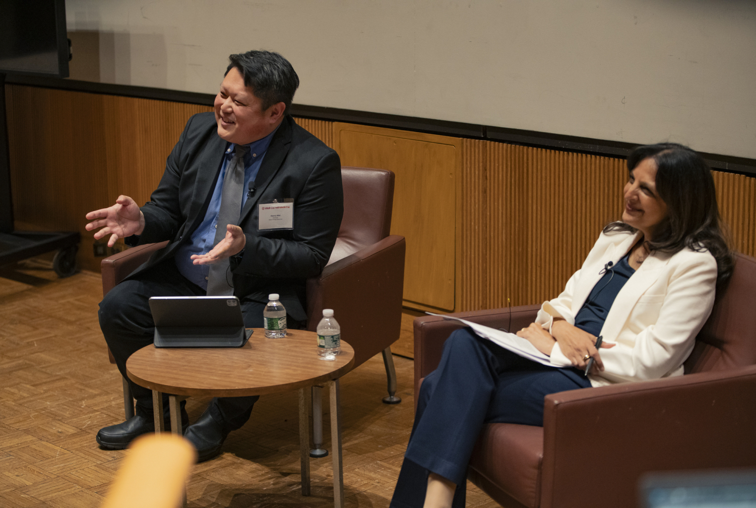 Two speakers seated on stage during a fireside chat at the BioInnovate Conference